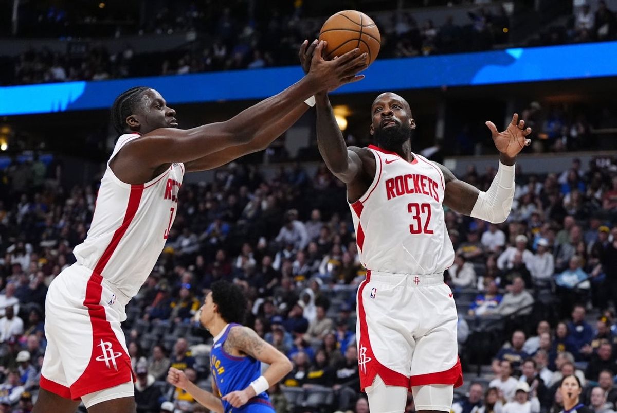Mar 11, 2026; Denver, Colorado, USA; Houston Rockets center Clint Capela (30) and forward Jeff Green (32) reach for a rebound in the fourth quarter against the Denver Nuggets at Ball Arena. Mandatory Credit: Ron Chenoy-Imagn Images