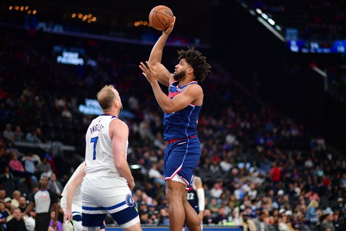 Mar 11, 2026; Inglewood, California, USA; Los Angeles Clippers forward Norchad Omier (55) shoots against Minnesota Timberwolves forward Joe Ingles (7) during the second half at Intuit Dome. Mandatory Credit: Gary A. Vasquez-Imagn Images