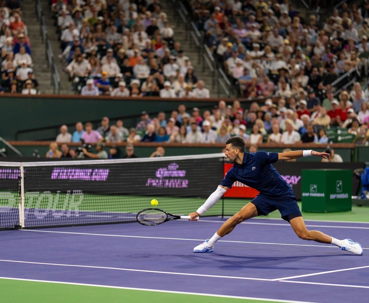 Novak Djokovic runs up to defend against Jack Draper during their fourth-round match at the BNP Paribas Open in Indian Wells, Calif., Wednesday, March 11, 2026.