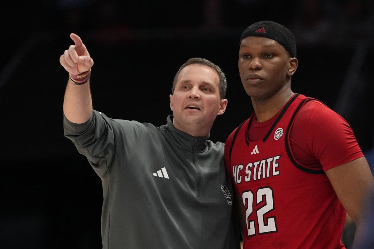 Mar 12, 2026; Charlotte, NC, USA; NC State Wolfpack head coach Will Wade with forward Ven-Allen Lubin (22) in the first half at Spectrum Center. Mandatory Credit: Bob Donnan-Imagn Images