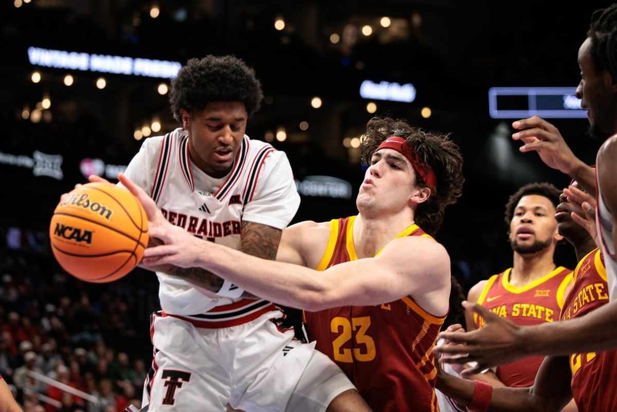 Mar 12, 2026; Kansas City, MO, USA; Texas Tech Red Raiders guard Christian Anderson (4) protects the ball from Iowa State Cyclones forward Blake Buchanan (23) during the first half at T-Mobile Center. Mandatory Credit: William Purnell-Imagn Images