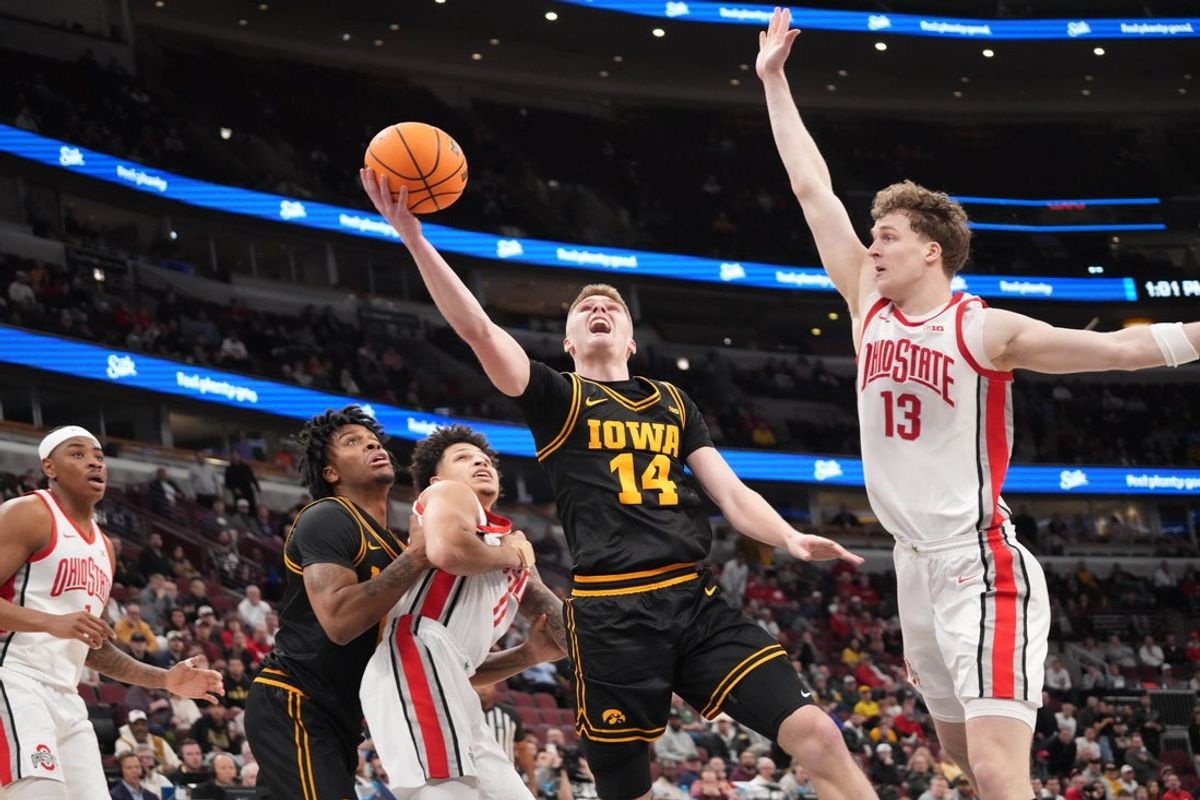Mar 12, 2026; Chicago, IL, USA; Ohio State Buckeyes center Christoph Tilly (13) defends Iowa Hawkeyes guard Bennett Stirtz (14) during the second half at United Center. Mandatory Credit: David Banks-Imagn Images