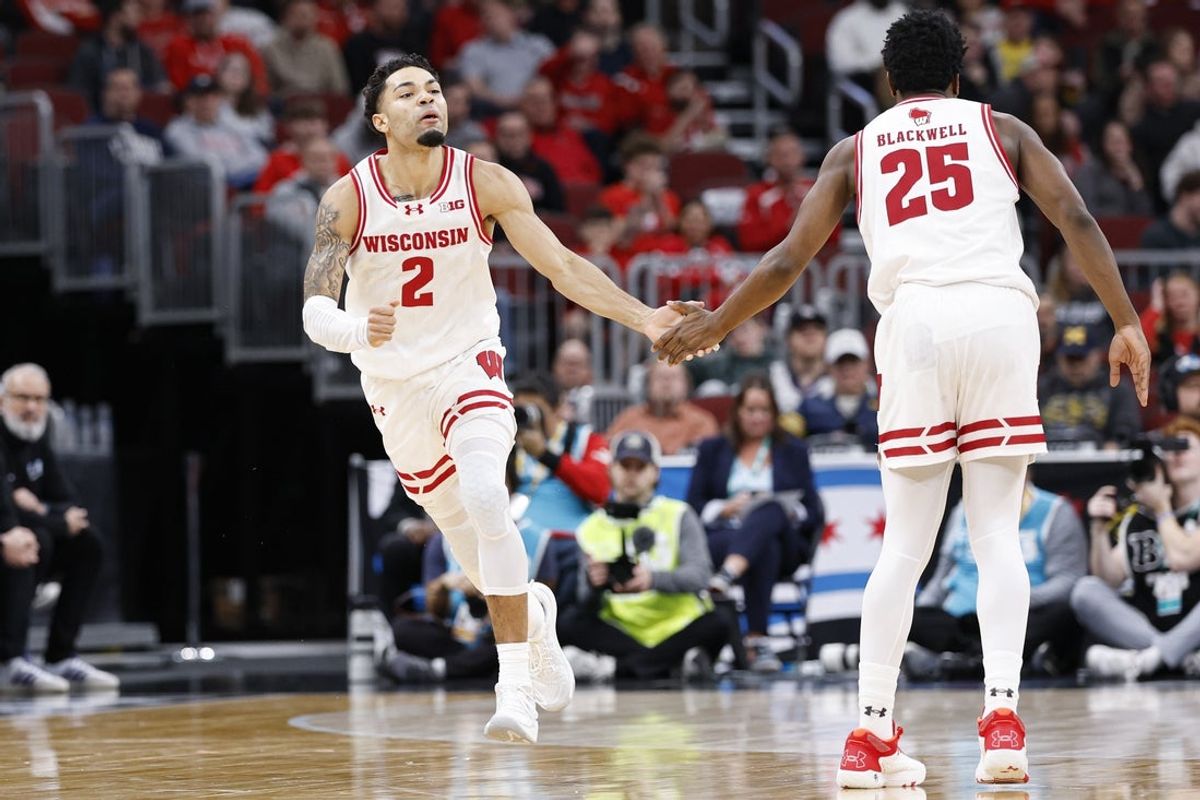 Mar 12, 2026; Chicago, IL, USA; Wisconsin Badgers guard Nick Boyd (2) reacts after scoring against the Washington Huskies during the first half at United Center. Mandatory Credit: Kamil Krzaczynski-Imagn Images