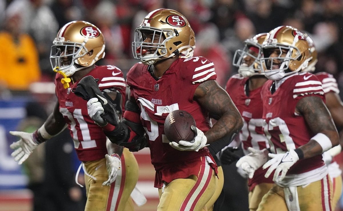 San Francisco 49ers linebacker Dre Greenlaw (57) celebrates his interception during the third quarter at Levi's Stadium.