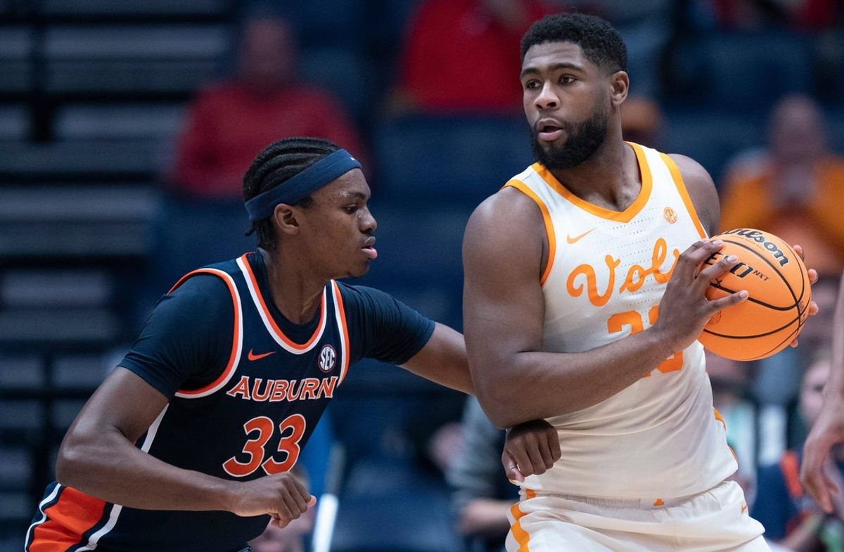 Auburn forward Sebastian Williams-Adams (33) guards Tennessee forward Jaylen Carey (23) during their Day 2 2026 SEC Men’s Basketball Tournament game at Bridgestone Arena in Nashville, Tenn., Thursday, March 12, 2026.
