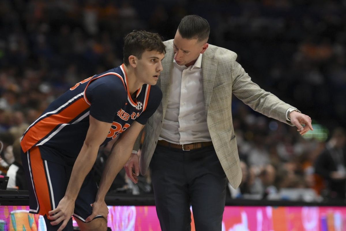 Mar 12, 2026; Nashville, TN, USA;  Auburn Tigers head coach Steven Pearl talks with forward Filip Jovic (38) against the Tennessee Volunteers during the first half at Bridgestone Arena. Mandatory Credit: Steve Roberts-Imagn Images