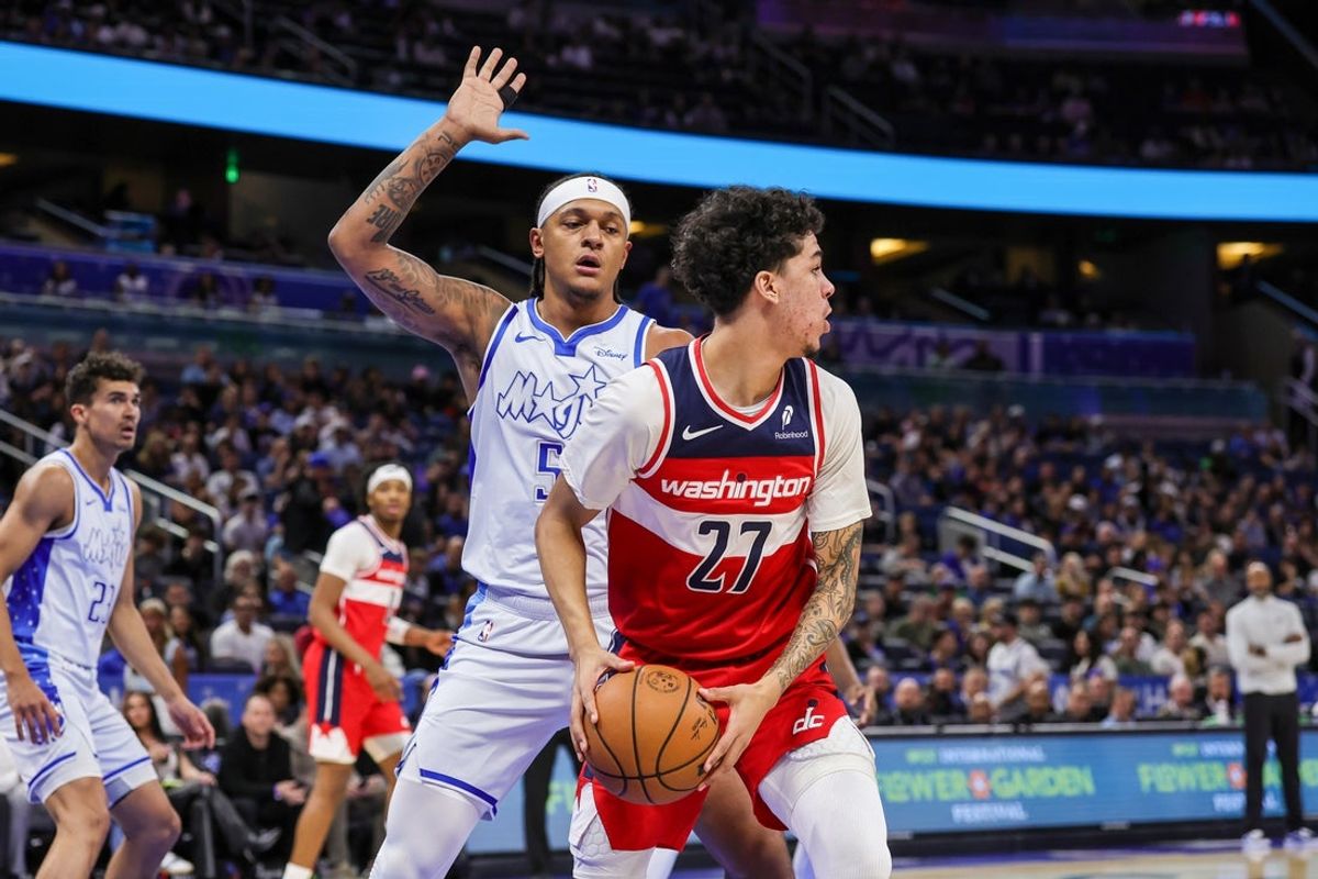 Mar 12, 2026; Orlando, Florida, USA; Orlando Magic forward Paolo Banchero (5) defends Washington Wizards guard Will Riley (27) during the first quarter at Kia Center. Mandatory Credit: Mike Watters-Imagn Images