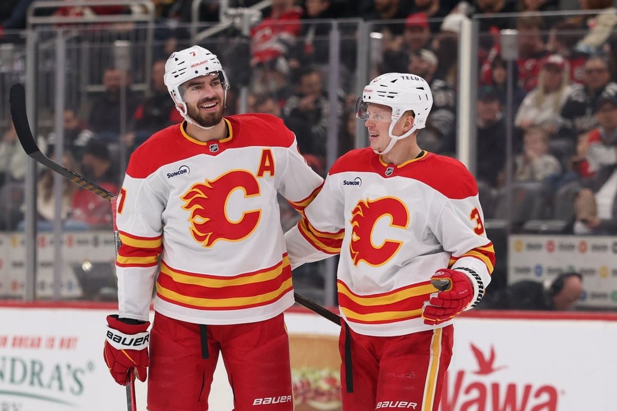 Mar 12, 2026; Newark, New Jersey, USA; Calgary Flames defenseman Kevin Bahl (7) celebrates his goal against the New Jersey Devils during the first period at Prudential Center. Mandatory Credit: Ed Mulholland-Imagn Images