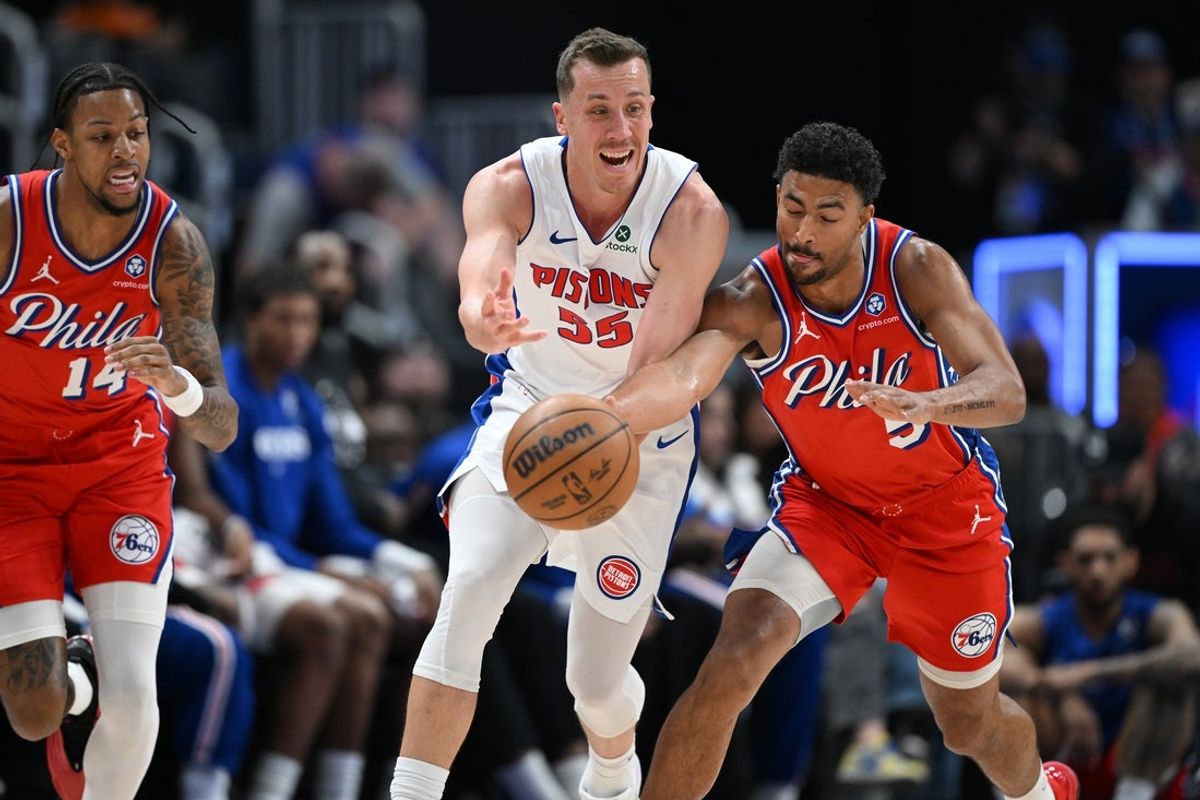Mar 12, 2026; Detroit, Michigan, USA;  Philadelphia 76ers guard Quentin Grimes (5) knocks the ball away from Detroit Pistons forward Duncan Robinson (55) in the first half at Little Caesars Arena. Mandatory Credit: Lon Horwedel-Imagn Images