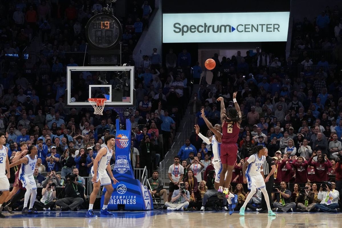 Mar 12, 2026; Charlotte, NC, USA; Florida State Seminoles guard Robert McCray V. (6) attempts a last second shot as Duke Blue Devils guard Dame Sarr (7) defends in the second half at Spectrum Center. Mandatory Credit: Bob Donnan-Imagn Images
