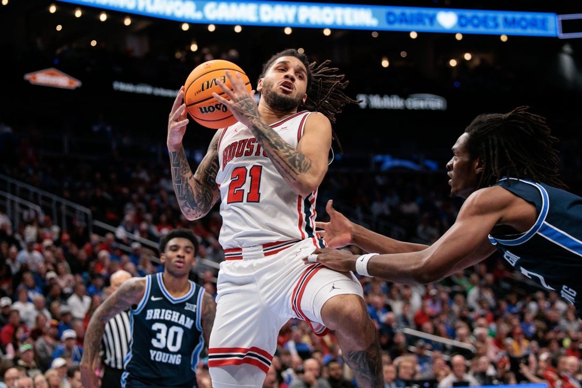 Mar 12, 2026; Kansas City, MO, USA; Houston Cougars guard Emanuel Sharp (21) rebounds during the second half against the BYU Cougars at T-Mobile Center. Mandatory Credit: William Purnell-Imagn Images