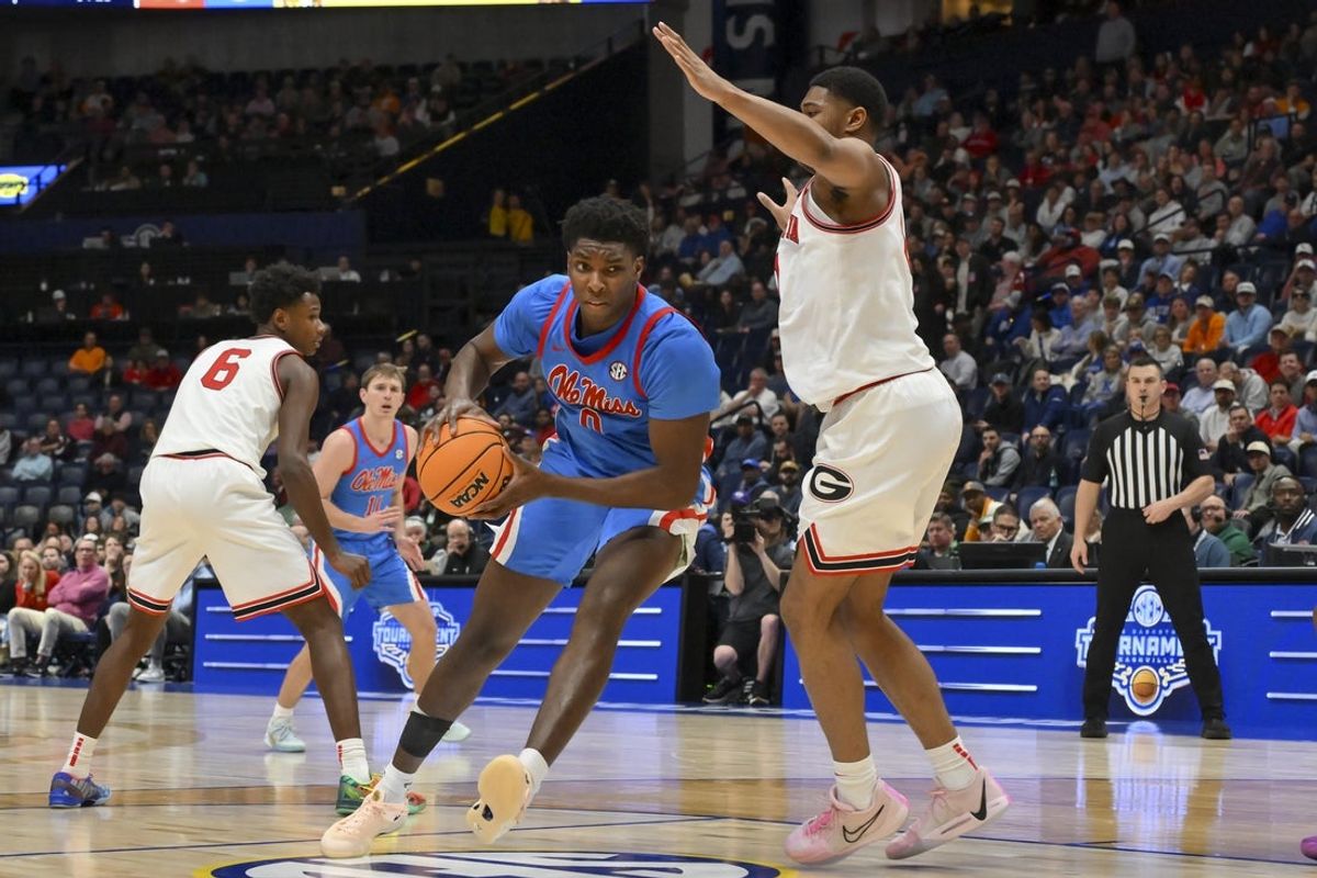 Mar 12, 2026; Nashville, TN, USA;  Mississippi Rebels forward Malik Dia (0) drives to the basket past Georgia Bulldogs forward Kareem Stagg (1) during the second half at Bridgestone Arena. Mandatory Credit: Steve Roberts-Imagn Images