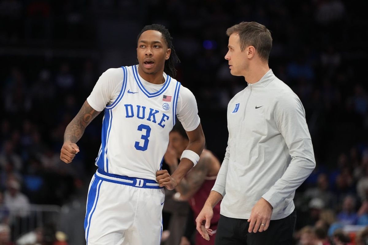 Mar 12, 2026; Charlotte, NC, USA; Duke Blue Devils guard Isaiah Evans (3) with the head coach Jon Scheyer in the second half at Spectrum Center. Mandatory Credit: Bob Donnan-Imagn Images