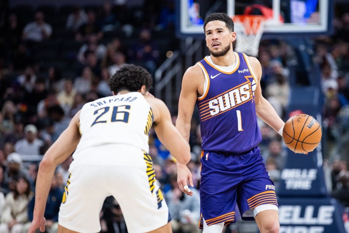Mar 12, 2026; Indianapolis, Indiana, USA;  Phoenix Suns guard Devin Booker (1) dribbles the ball while Indiana Pacers guard Ben Sheppard (26) defends in the second half at Gainbridge Fieldhouse. Mandatory Credit: Trevor Ruszkowski-Imagn Images