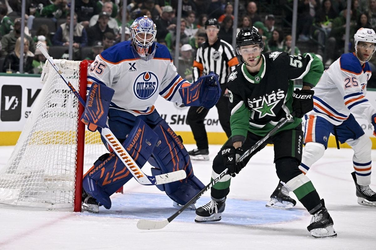Mar 12, 2026; Dallas, Texas, USA; Dallas Stars center Wyatt Johnston (53) looks for the puck in front of Edmonton Oilers goaltender Tristan Jarry (35) during the second period at the American Airlines Center. Mandatory Credit: Jerome Miron-Imagn Images