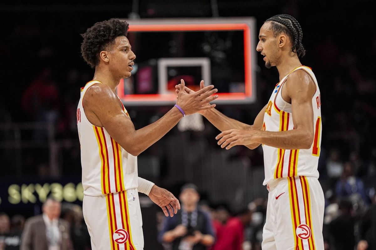 Mar 12, 2026; Atlanta, Georgia, USA; Atlanta Hawks forwards Jalen Johnson (1) and Zaccharie Risacher (10) react after the Hawks defeated the Brooklyn Nets at State Farm Arena. Mandatory Credit: Dale Zanine-Imagn Images