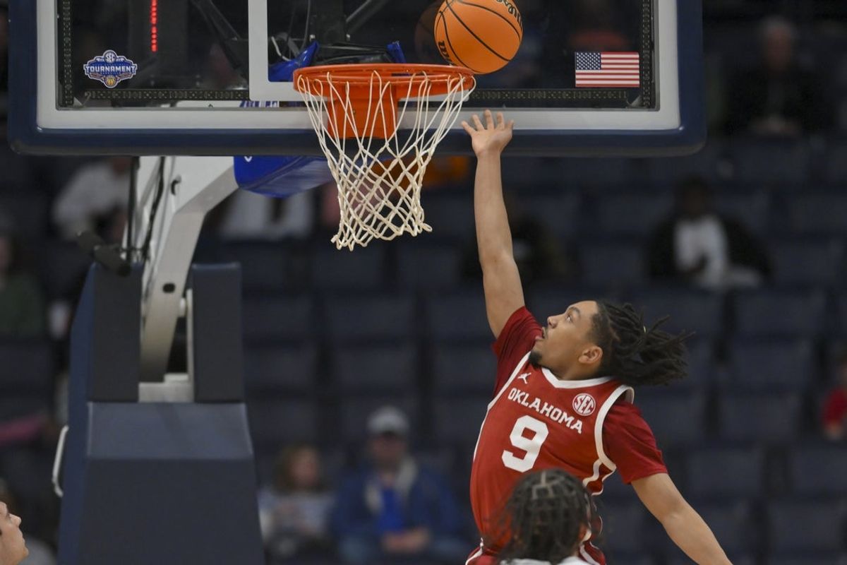 Mar 12, 2026; Nashville, TN, USA;  Oklahoma Sooners guard Nijel Pack (9) lays the ball in against the Texas A&M Aggies during the first half at Bridgestone Arena. Mandatory Credit: Steve Roberts-Imagn Images