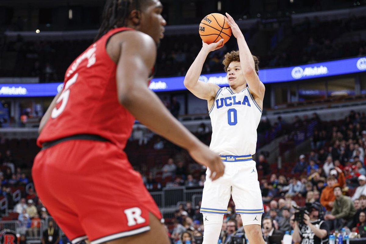 Mar 12, 2026; Chicago, IL, USA; UCLA Bruins guard Trent Perry (0) shoots against the Rutgers Scarlet Knights during the second half at United Center. Mandatory Credit: Kamil Krzaczynski-Imagn Images