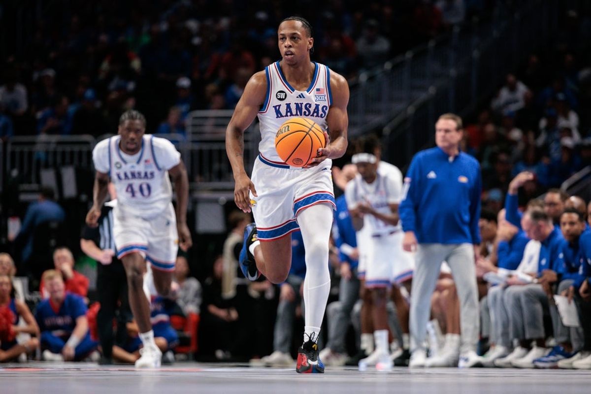 Mar 12, 2026; Kansas City, MO, USA; Kansas Jayhawks guard Elmarko Jackson (13) brings the ball up court during the first half against the TCU Horned Frogs at T-Mobile Center. Mandatory Credit: William Purnell-Imagn Images