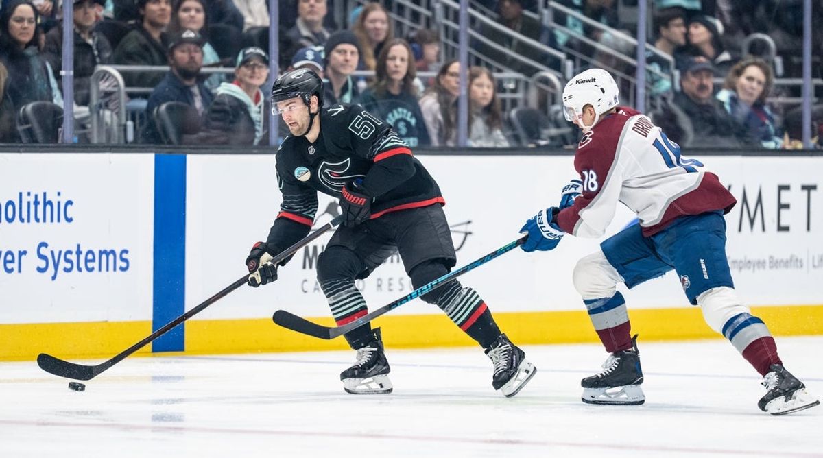 Mar 12, 2026; Seattle, Washington, USA; Seattle Kraken forward Shane Wright (51) skates against Colorado Avalancheforward Jack Drury (18) during the first period at Climate Pledge Arena. Mandatory Credit: Stephen Brashear-Imagn Images