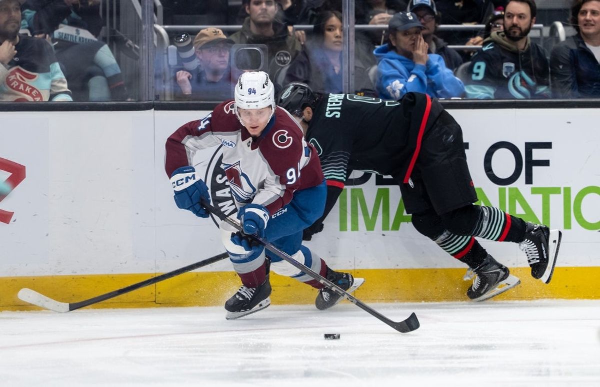 Mar 12, 2026; Seattle, Washington, USA; Colorado Avalanche forward Joel Kiviranta (94) skates against Seattle Kraken forward Chandler Stephenson (9) during the second period at Climate Pledge Arena. Mandatory Credit: Stephen Brashear-Imagn Images