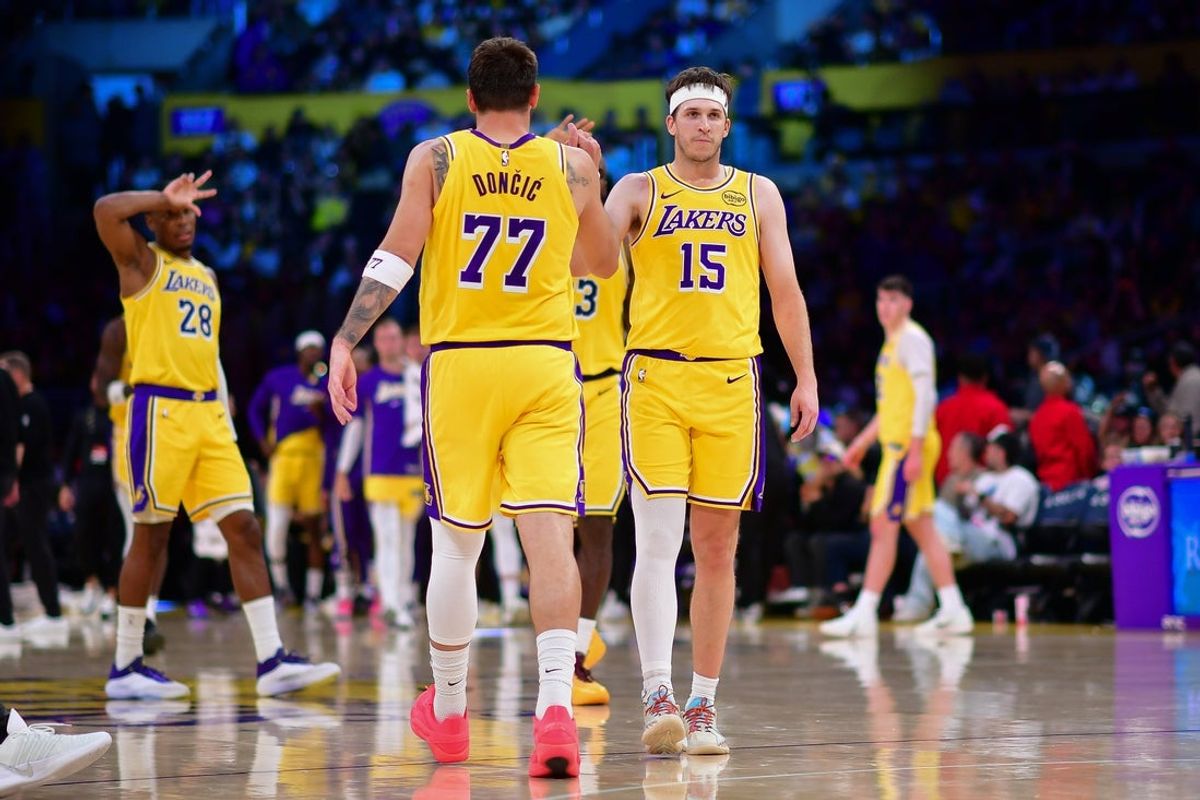 Mar 12, 2026; Los Angeles, California, USA; Los Angeles Lakers guard Luka Doncic (77) and guard Austin Reaves (15) react during the second half at Crypto.com Arena. Mandatory Credit: Gary A. Vasquez-Imagn Images