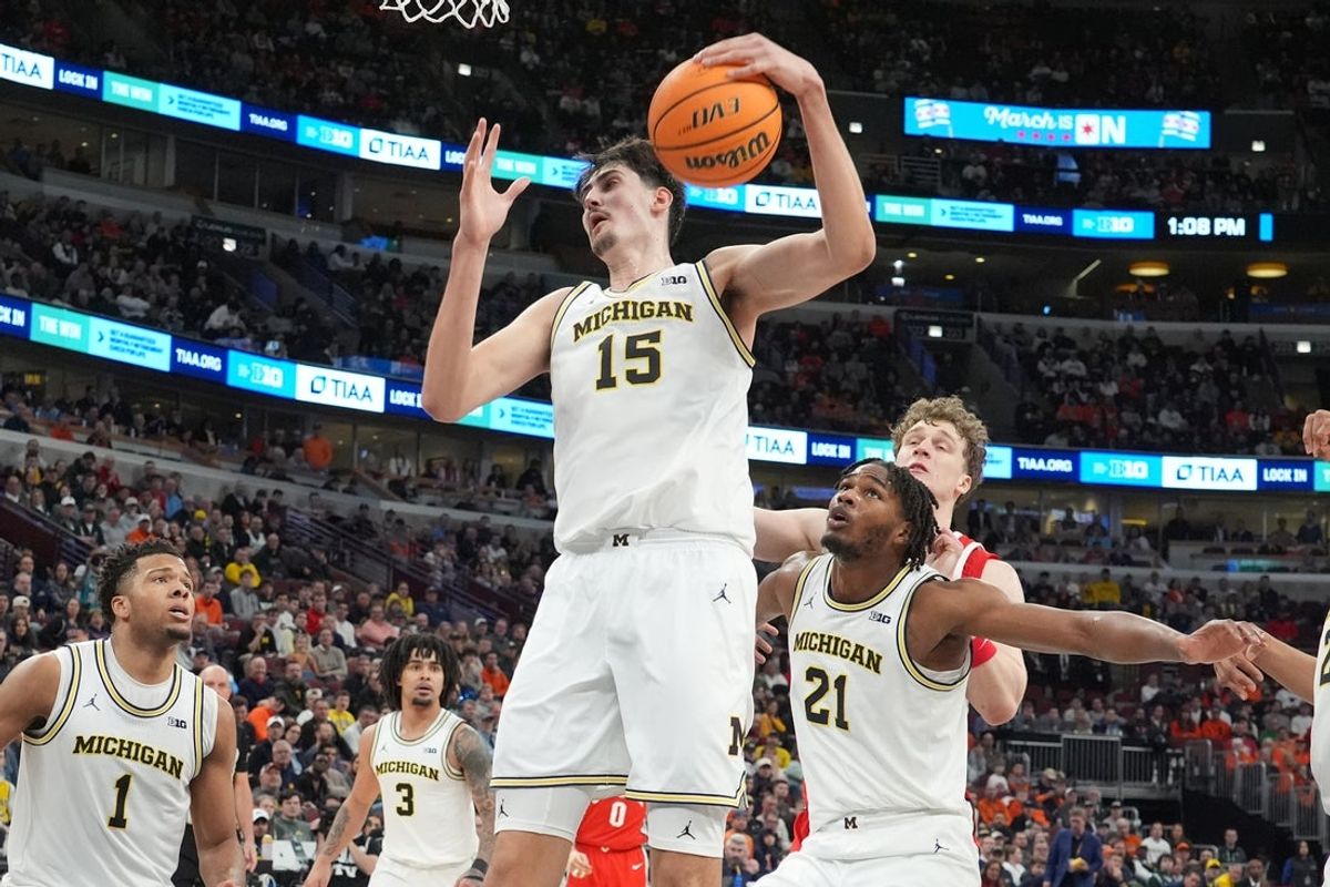 Mar 13, 2026; Chicago, IL, USA; Michigan Wolverines center Aday Mara (15) grabs a rebound against the Ohio State Buckeyes during the second half at United Center. Mandatory Credit: David Banks-Imagn Images