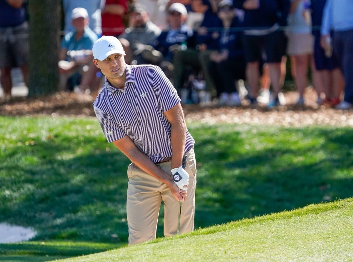 Mar 13, 2026; Ponte Vedra Beach, Florida, USA; Ludvig Aberg watches as his eagle chip rolls in the hole on the ninth green during the second round of THE PLAYERS Championship golf tournament. Mandatory Credit: Jeff Romance-Imagn Images
