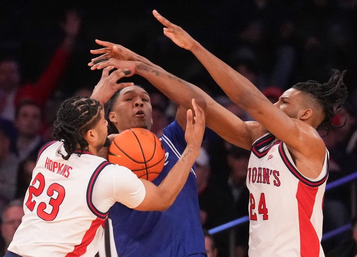 Mar 13, 2026; New York, NY, USA;  Seton Hall Pirates forward Stephon Payne III (6) stopped by St. John's Red Storm forward Bryce Hopkins (23) ands St. John's Red Storm forward Zuby Ejiofor (24) during the first half at Madison Square Garden. Mandatory Credit: Robert Deutsch-Imagn Images