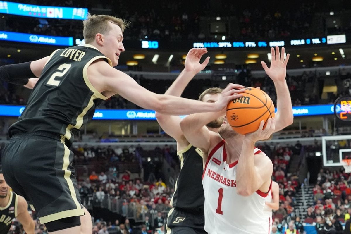 Mar 13, 2026; Chicago, IL, USA; Purdue Boilermakers guard Fletcher Loyer (2) defends Nebraska Cornhuskers guard Sam Hoiberg (1) during the first half at United Center. Mandatory Credit: David Banks-Imagn Images