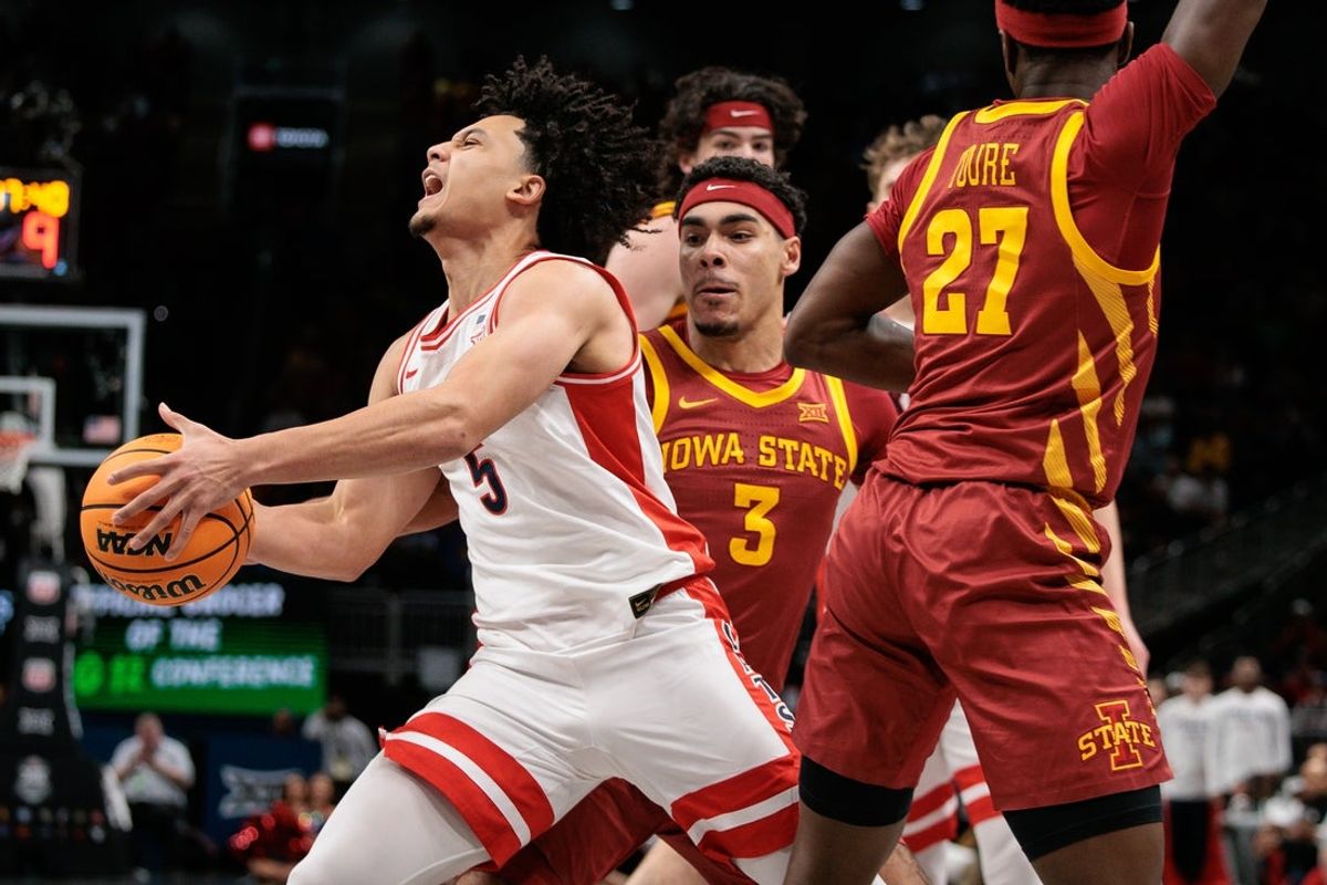 Mar 13, 2026; Kansas City, MO, USA; Arizona Wildcats guard Brayden Burries (5) collides with Iowa State Cyclones guard Tamin Lipsey (3) during the first half at T-Mobile Center. Mandatory Credit: William Purnell-Imagn Images
