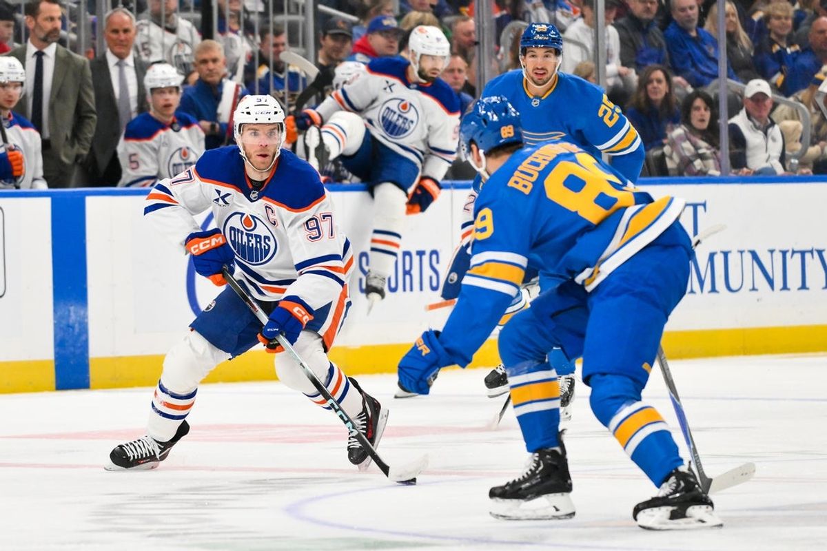 Mar 13, 2026; St. Louis, Missouri, USA; Edmonton Oilers center Connor McDavid (97) controls the puck as St. Louis Blues left wing Pavel Buchnevich (89) defends during the first period at Enterprise Center. Mandatory Credit: Jeff Curry-Imagn Images