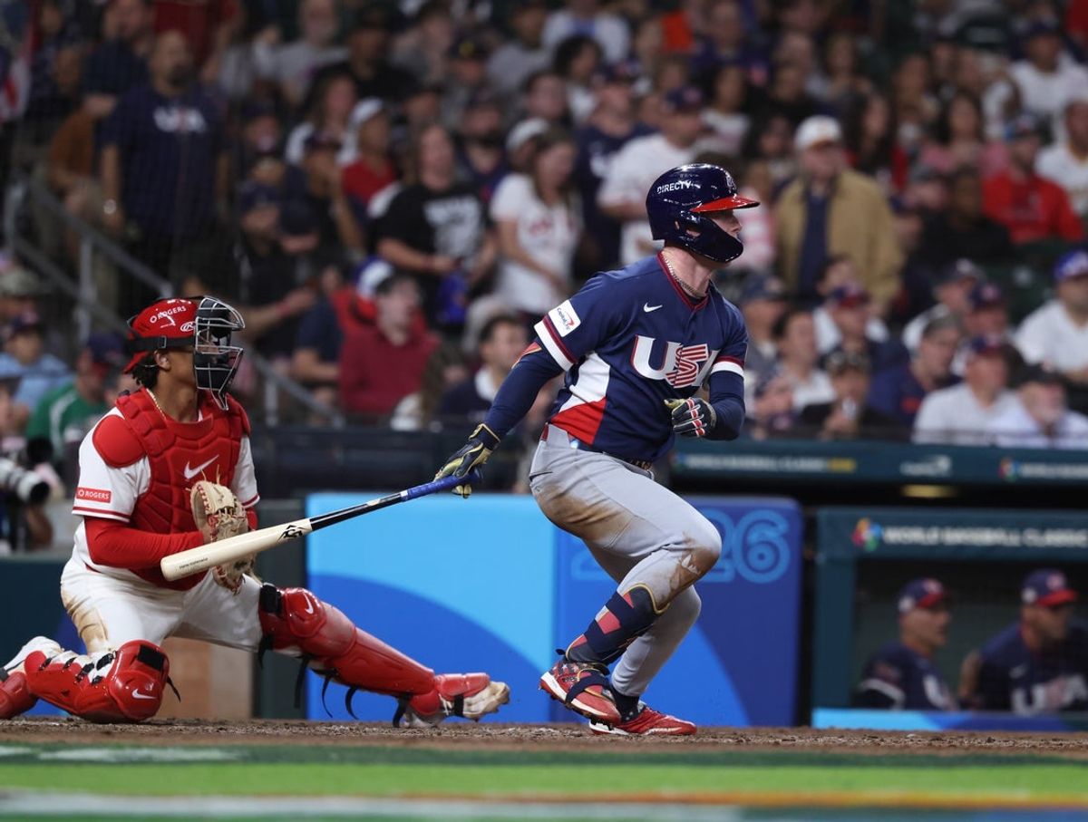 Mar 13, 2026; Houston, TX, United States; United States center fielder Pete Crow-Armstrong (4) hits an RBI single during the sixth inning against Canada during a quarterfinal game of the 2026 World Baseball Classic at Daikin Park. Mandatory Credit: Troy Taormina-Imagn Images