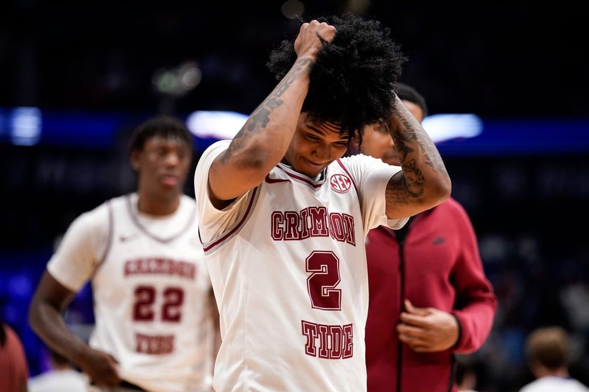 Alabama guard Aden Holloway (2) reacts after Mississippi won a SEC tournament quarterfinal game at Bridgestone Arena in Nashville, Tenn., Friday, March 13, 2026.