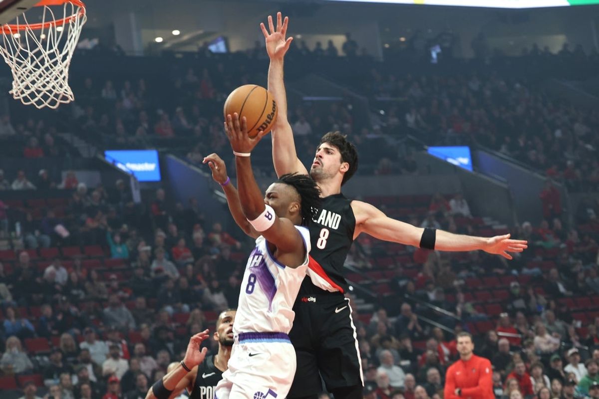 Mar 13, 2026; Portland, Oregon, USA;  Portland Trail Blazers forward Deni Avdija (8) defends Utah Jazz guard Isaiah Collier (8) during the first half at Moda Center. Mandatory Credit: Jaime Valdez-Imagn Images