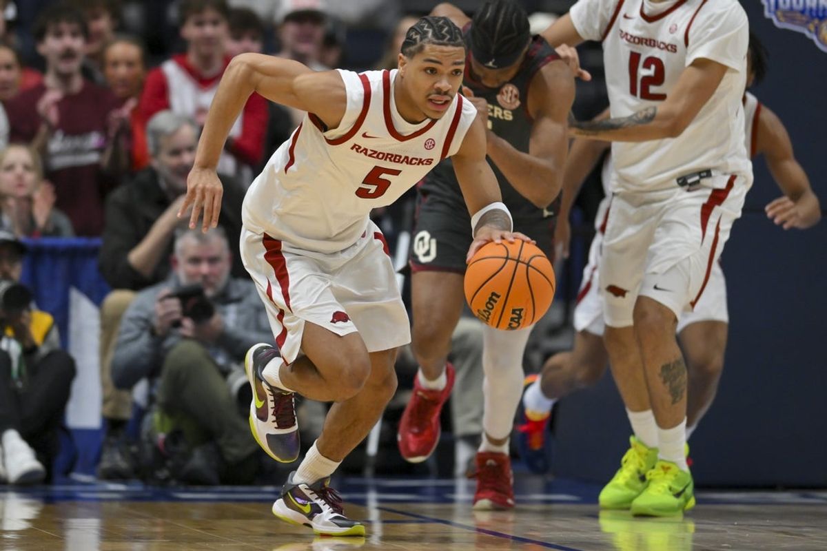 Mar 13, 2026; Nashville, TN, USA;  Arkansas Razorbacks guard Darius Acuff Jr. (5) brings the ball up court against the Oklahoma Sooners during the first half at Bridgestone Arena. Mandatory Credit: Steve Roberts-Imagn Imagesduring the first half