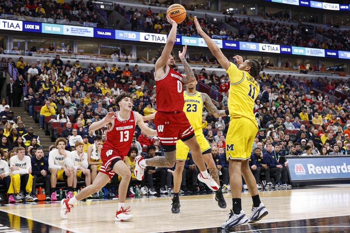Mar 14, 2026; Chicago, IL, USA; Michigan Wolverines guard Patrick Liburd (0) shoots against Michigan Wolverines guard Roddy Gayle Jr. (11) during the first half at United Center. Mandatory Credit: Kamil Krzaczynski-Imagn Images