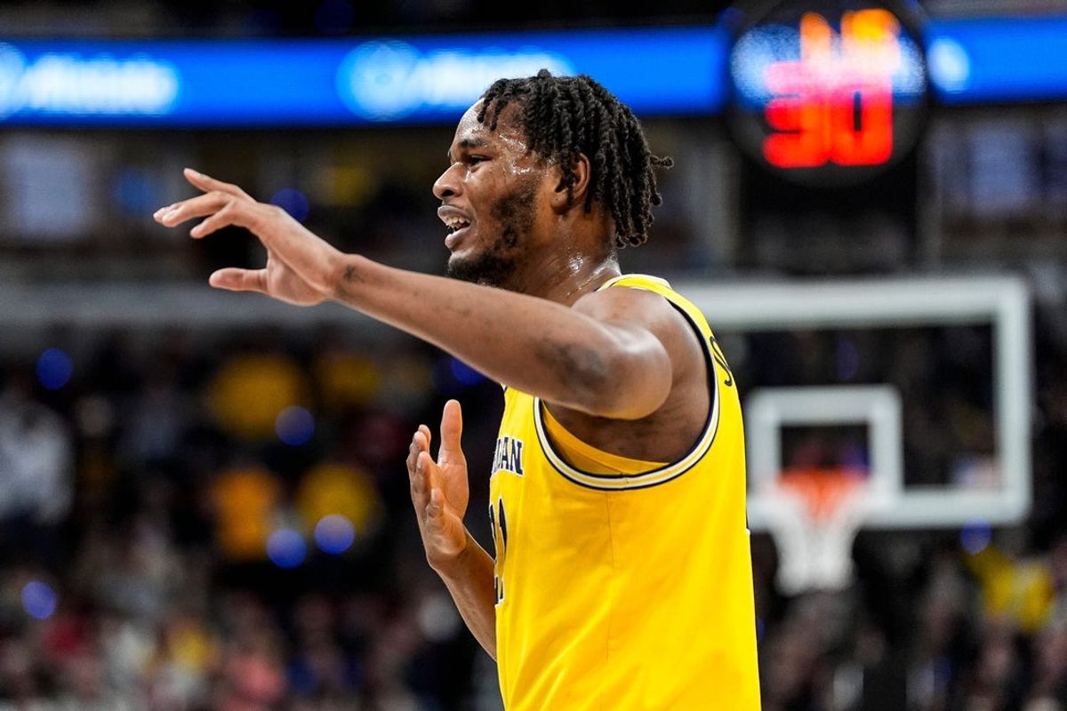 Michigan forward Morez Johnson Jr. (21) celebrates a play against Wisconsin during the first half of Big Ten Tournament semifinal at United Center in Chicago on Saturday, March 14, 2026.