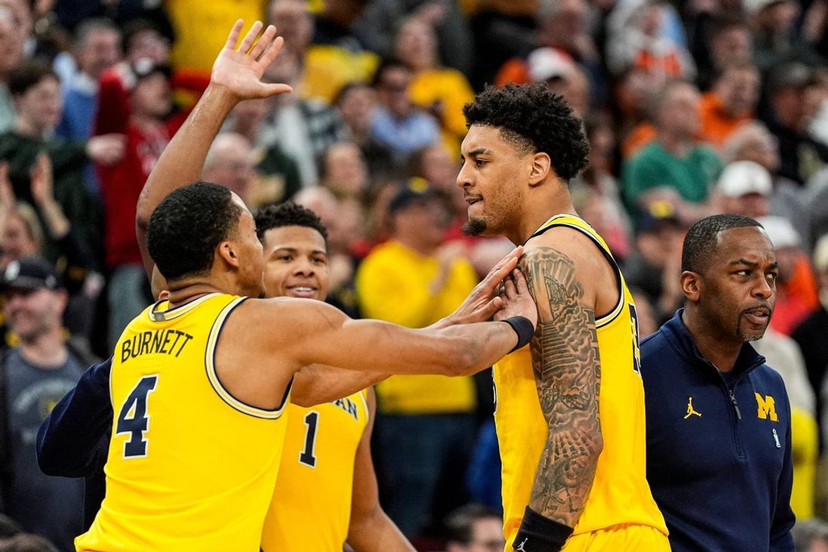 Michigan forward Yaxel Lendeborg (23) celebrates a 3-pointer against Wisconsin with guard Nimari Burnett (4)during the second half of Big Ten Tournament semifinal at United Center in Chicago on Saturday, March 14, 2026.