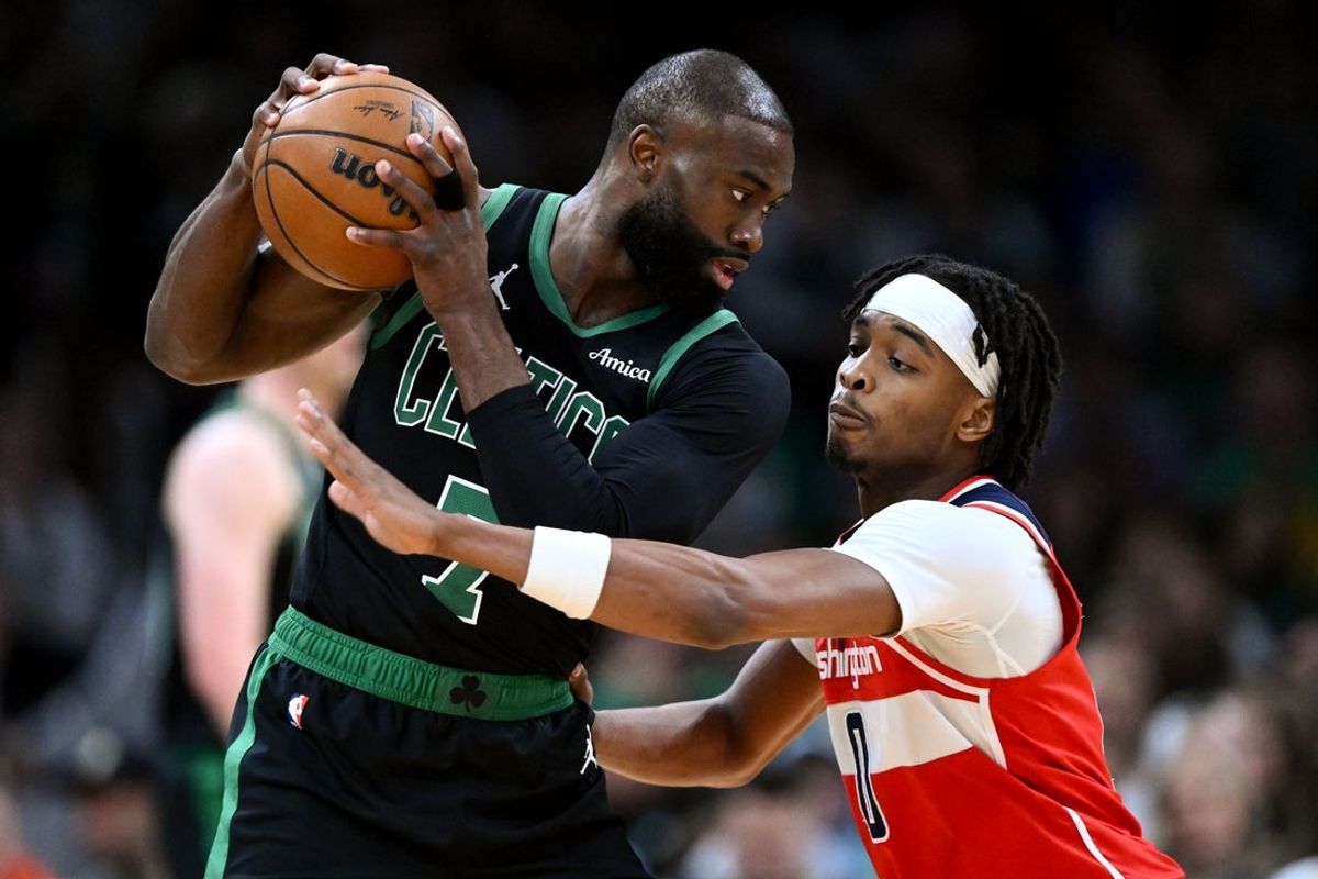 Mar 14, 2026; Boston, Massachusetts, USA; Boston Celtics guard Jaylen Brown (7) controls the ball against Washington Wizards guard Bilal Coulibaly (0) during the first half at the TD Garden. Mandatory Credit: Brian Fluharty-Imagn Images