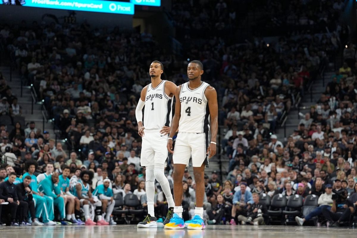 Mar 14, 2026; San Antonio, Texas, USA;  San Antonio Spurs forward Victor Wembanyama (1) and guard De'aaron Fox (4) look back up the court in the second half against the Charlotte Hornets at Frost Bank Center. Mandatory Credit: Daniel Dunn-Imagn Images