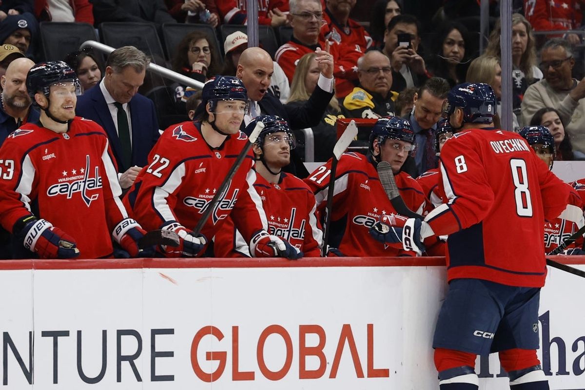 Mar 9, 2026; Washington, District of Columbia, USA; Washington Capitals left wing Alex Ovechkin (8) talks with Capitals head coach Spencer Carbery (L) during a referee review against the Boston Bruins during the third period at Capital One Arena. Mandatory Credit: Geoff Burke-Imagn Images