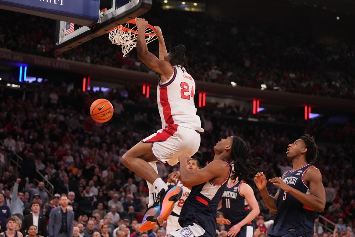 Mar 14, 2026; New York, NY, USA; St. John's Red Storm forward Zuby Ejiofor (24) follows through on a dunk against the Connecticut Huskies during the first half of the men's Big East Conference Tournament Championship at Madison Square Garden. Mandatory Credit: Robert Deutsch-Imagn Images