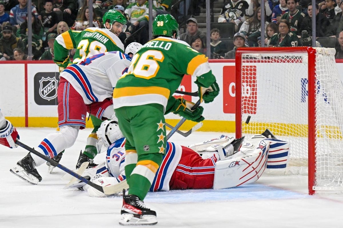 Mar 14, 2026; Saint Paul, Minnesota, USA;  New York Rangers goalie Igor Shesterkin (31) makes a save on Minnesota Wild forward Ryan Hartman (38) during the second period at Grand Casino Arena. Mandatory Credit: Nick Wosika-Imagn Images