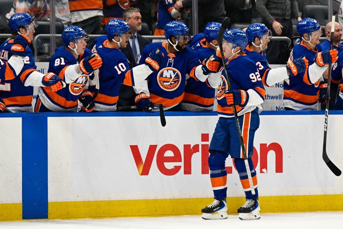 Mar 14, 2026; Elmont, New York, USA;  New York Islanders right wing Simon Holmstrom (92) celebrates his second goal against the Calgary Flames during the first period at UBS Arena. Mandatory Credit: Dennis Schneidler-Imagn Images