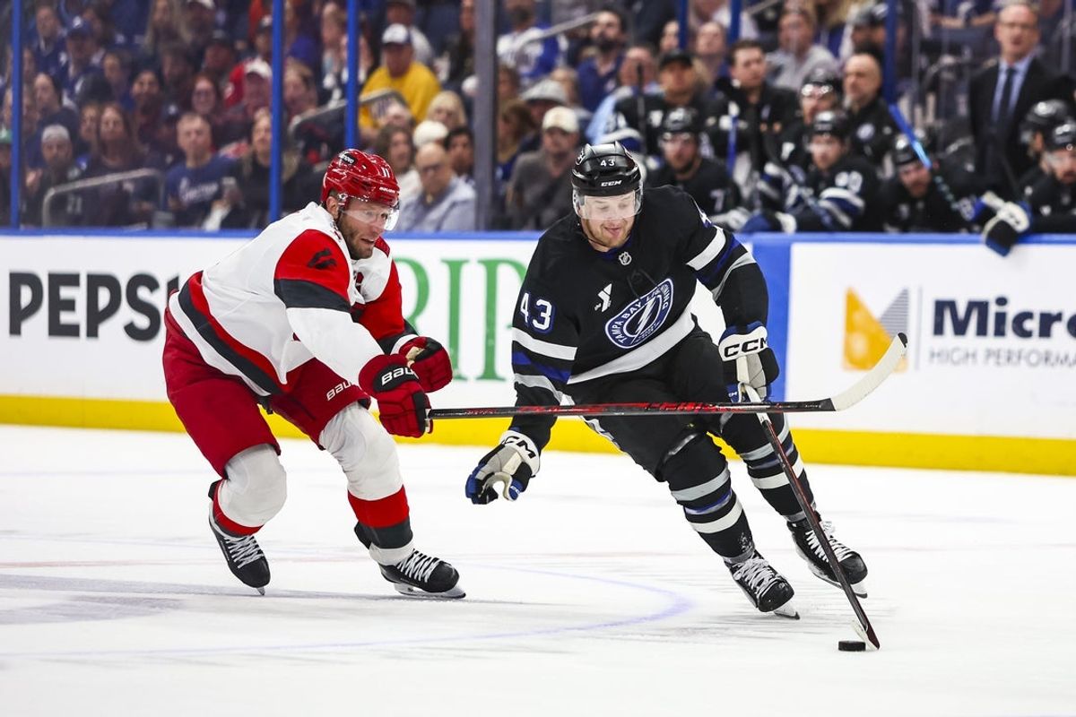 Mar 14, 2026; Tampa, Florida, USA; Carolina Hurricanes forward Jordan Staal (11) defends Tampa Bay Lightning defenseman Darren Raddysh (43) in the first period at Benchmark International Arena. Mandatory Credit: Morgan Tencza-Imagn Images