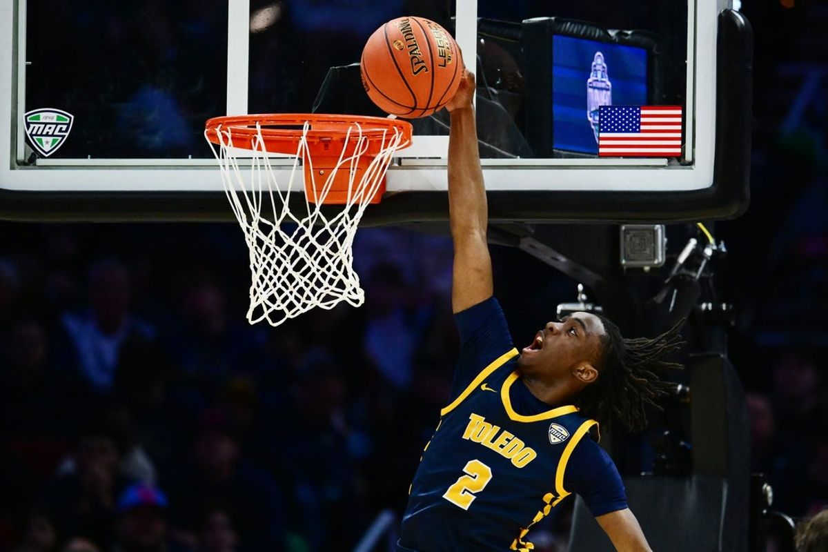 Mar 14, 2026; Cleveland, OH, USA; Toledo Rockets guard Leroy Blyden Jr. (2) dunks against the Akron Zips during the first half of the men’s Mid-American Conference Championship at Rocket Arena. Mandatory Credit: Ken Blaze-Imagn Images
