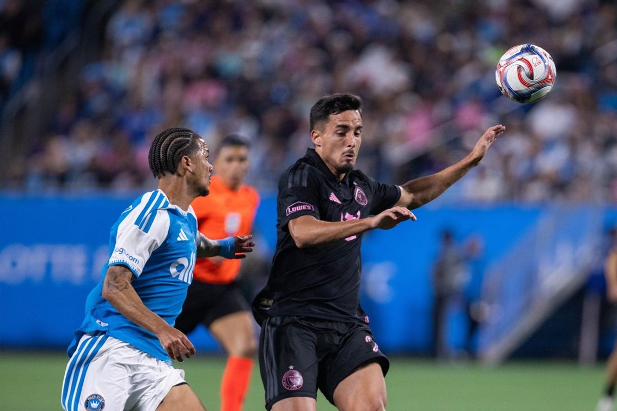 Mar 14, 2026; Charlotte, North Carolina, USA; Inter Miami midfielder Santiago Morales (20) cuts off Charlotte FC forward Idan Toklomati (9) during the first half at Bank of America Stadium. Mandatory Credit: Scott Kinser-Imagn Images