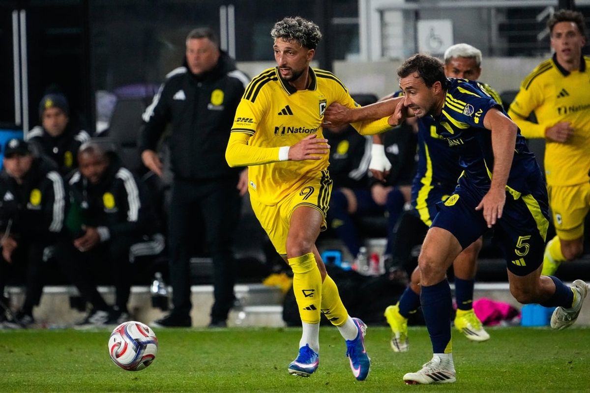 Columbus Crew forward Wessam Abou Ali (9) runs to the ball against Nashville SC defender Jack Maher (5) in the second half of the MLS game at ScottsMiracle-Gro Field on Saturday, March 14, 2026 in Columbus, Ohio.