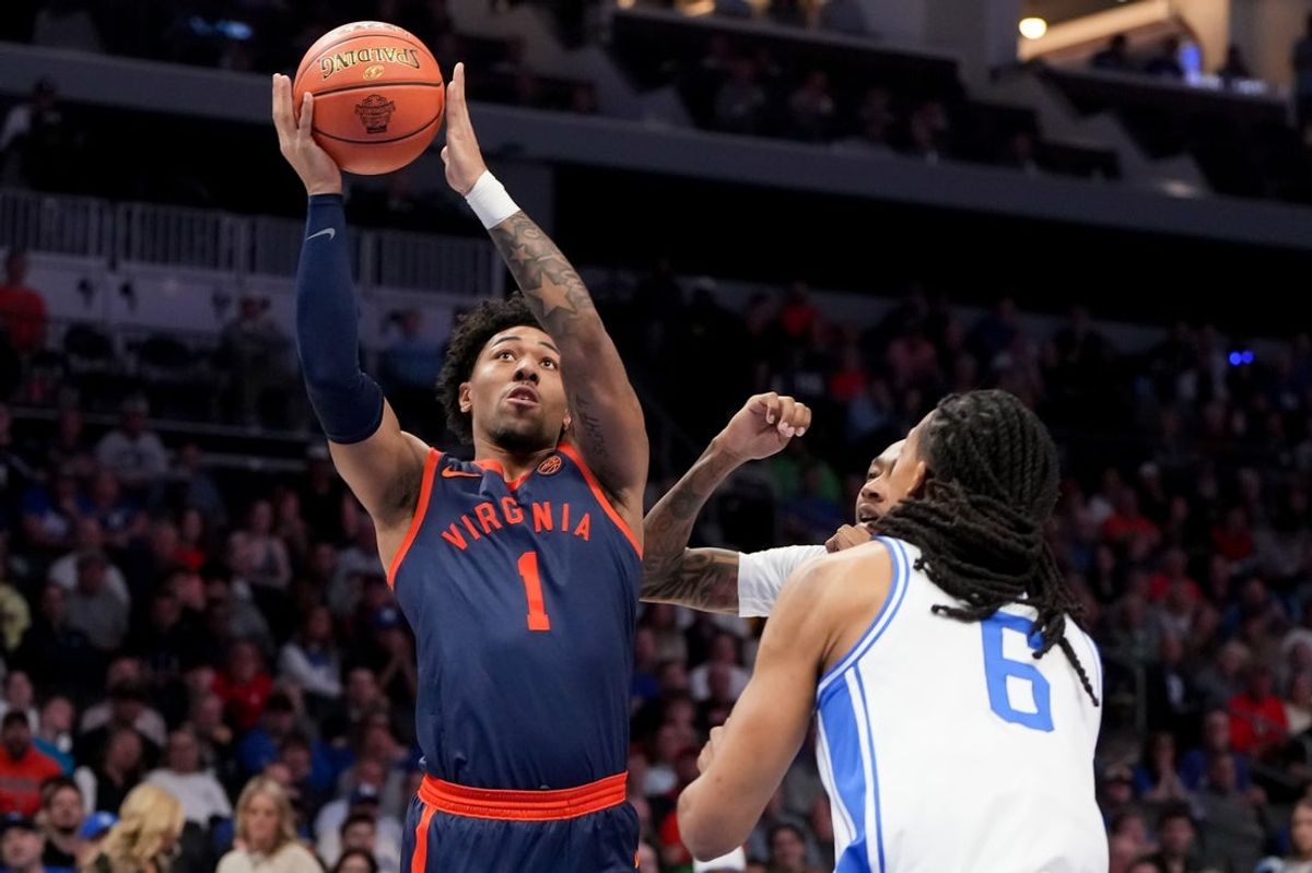 Mar 14, 2026; Charlotte, NC, USA; Virginia Cavaliers guard Malik Thomas (1) shoots past Duke Blue Devils forward Maliq Brown (6) during the men's ACC Conference Tournament Championship at Spectrum Center. Mandatory Credit: Bob Donnan-Imagn Images